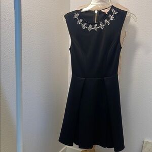 Elegant Black Dress with Embellished Neckline